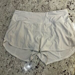Lululemon Speed Up Shorts 4 inch Size 12. Bone color